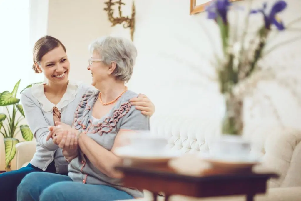 Senior woman talking with a nurse