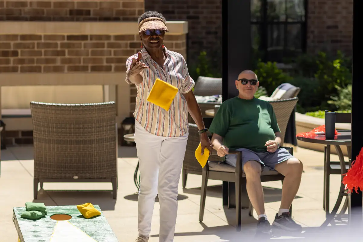 Clarendale Clayton residents playing cornhole