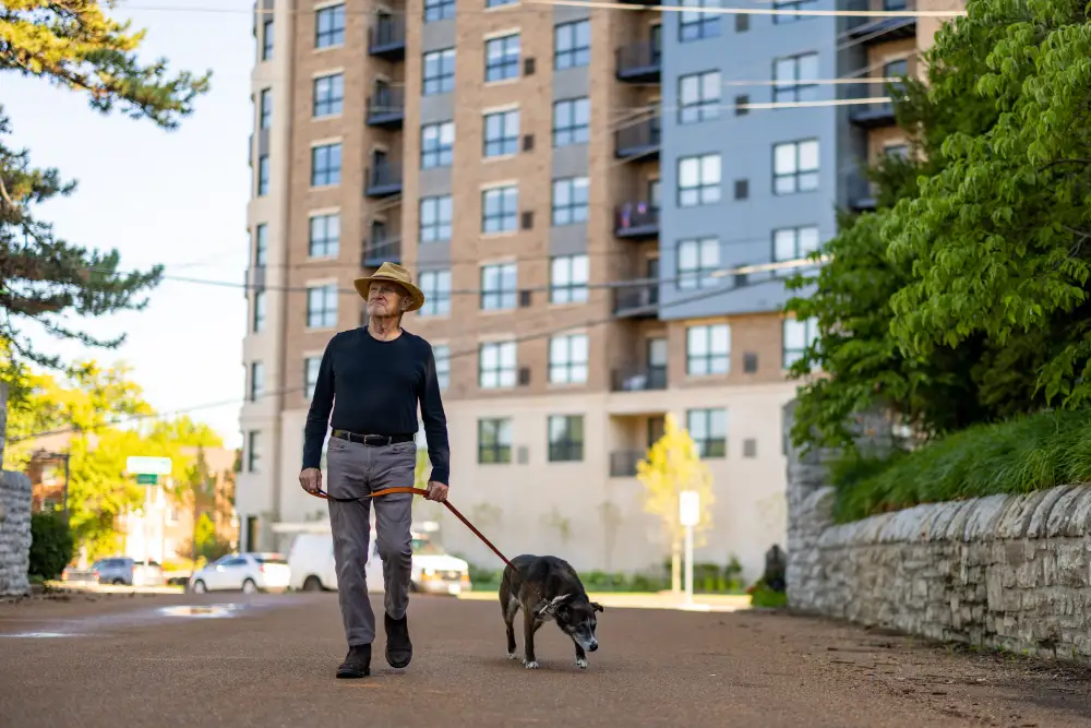 Clarendale Clayton resident walking his dog in the city