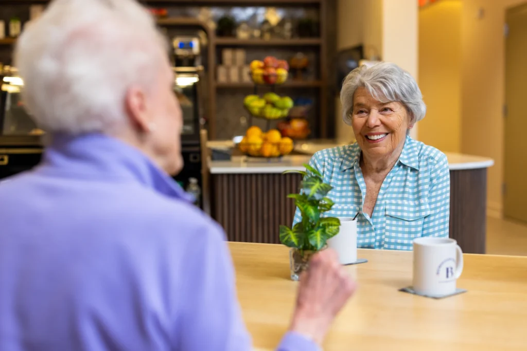 senior women having coffee at Clarendale Clayton, a senior living community in Clayton, MO.