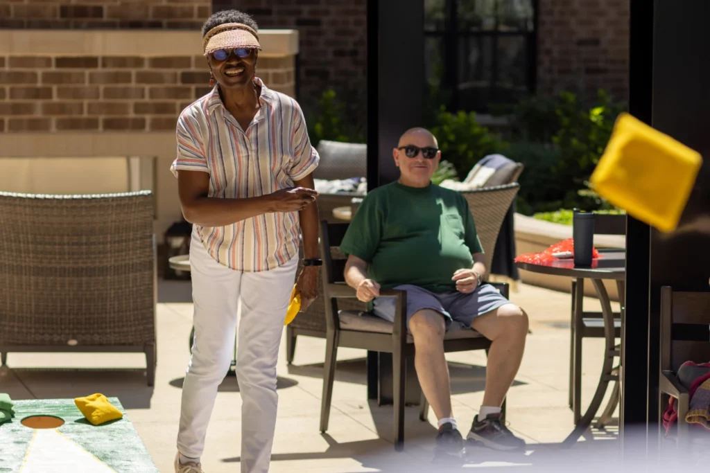 seniors at Clarendale Clayton playing bean bag toss 